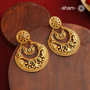 These Gold Polish Silver Chandbali Earrings showcase intricate rava and filigree craftsmanship, reflecting timeless traditional design. Crafted from 92.5% sterling silver with a delicate gold polish, they offer enduring elegance suitable for generations. Their classic style ensures they remain a fashionable choice for any occasion.