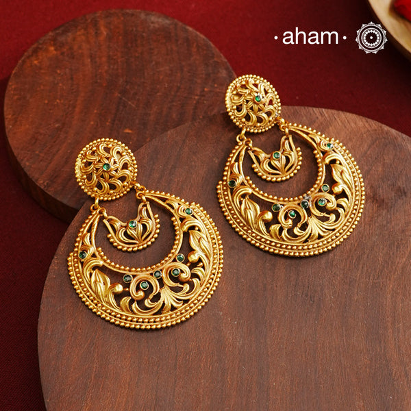 These Gold Polish Silver Chandbali Earrings showcase intricate rava and filigree craftsmanship, reflecting timeless traditional design. Crafted from 92.5% sterling silver with a delicate gold polish, they offer enduring elegance suitable for generations. Their classic style ensures they remain a fashionable choice for any occasion.
