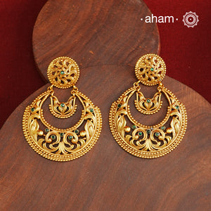 These Gold Polish Silver Chandbali Earrings showcase intricate rava and filigree craftsmanship, reflecting timeless traditional design. Crafted from 92.5% sterling silver with a delicate gold polish, they offer enduring elegance suitable for generations. Their classic style ensures they remain a fashionable choice for any occasion.