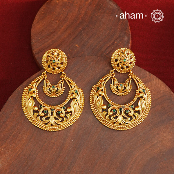 These Gold Polish Silver Chandbali Earrings showcase intricate rava and filigree craftsmanship, reflecting timeless traditional design. Crafted from 92.5% sterling silver with a delicate gold polish, they offer enduring elegance suitable for generations. Their classic style ensures they remain a fashionable choice for any occasion.