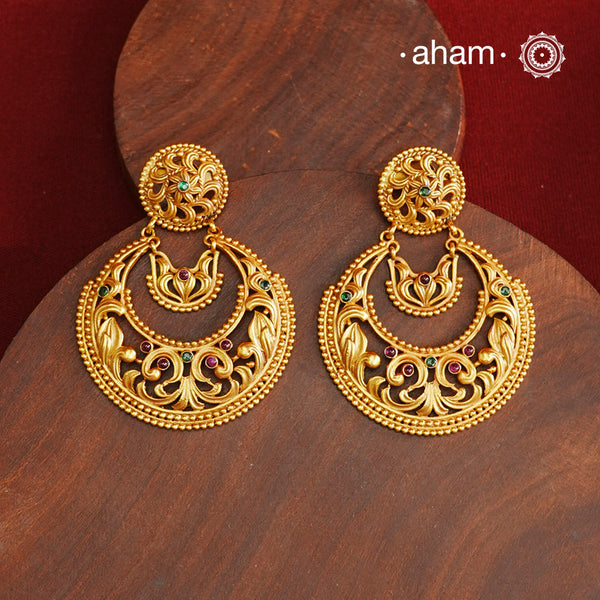 These Gold Polish Silver Chandbali Earrings showcase intricate rava and filigree craftsmanship, reflecting timeless traditional design. Crafted from 92.5% sterling silver with a delicate gold polish, they offer enduring elegance suitable for generations. Their classic style ensures they remain a fashionable choice for any occasion.