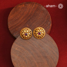 Traditional Gold Polish Studs with a kemp Center.Handcrafted using traditional methods in 92.5 sterling silver with gold polish.Perfect to Pair these with your ethnic outfits this festive season.