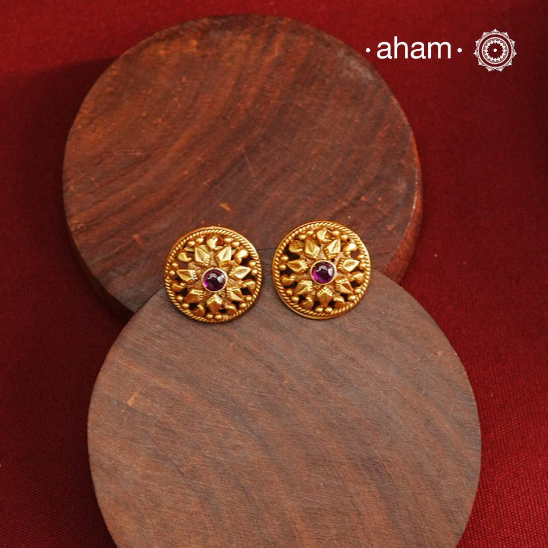 Traditional Gold Polish Studs with a kemp Center.Handcrafted using traditional methods in 92.5 sterling silver with gold polish.Perfect to Pair these with your ethnic outfits this festive season.
