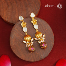 These Gold Polish Peacock Silver Earrings beautifully reflect the elegance of South Indian traditional design, featuring delicate kemp and pearl work along with some kundan highlights. Crafted from 92.5% pure silver with a fine gold polish, it is a graceful and timeless design that complements your style effortlessly.