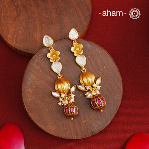 These Gold Polish Peacock Silver Earrings beautifully reflect the elegance of South Indian traditional design, featuring delicate kemp and pearl work along with some kundan highlights. Crafted from 92.5% pure silver with a fine gold polish, it is a graceful and timeless design that complements your style effortlessly.