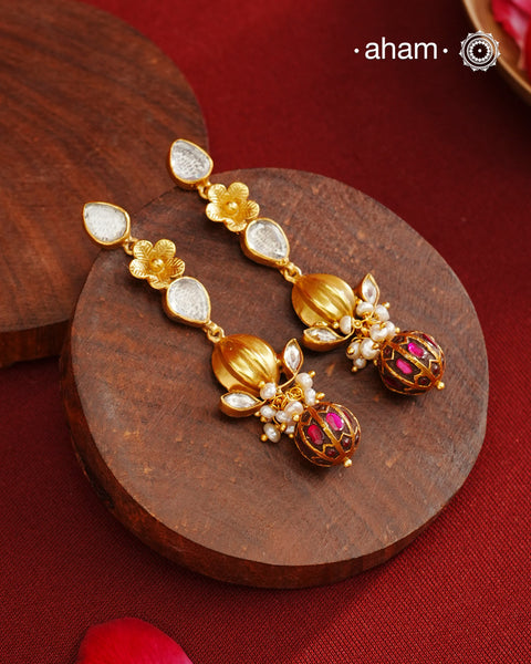 These Gold Polish Peacock Silver Earrings beautifully reflect the elegance of South Indian traditional design, featuring delicate kemp and pearl work along with some kundan highlights. Crafted from 92.5% pure silver with a fine gold polish, it is a graceful and timeless design that complements your style effortlessly.