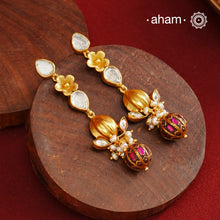These Gold Polish Peacock Silver Earrings beautifully reflect the elegance of South Indian traditional design, featuring delicate kemp and pearl work along with some kundan highlights. Crafted from 92.5% pure silver with a fine gold polish, it is a graceful and timeless design that complements your style effortlessly.