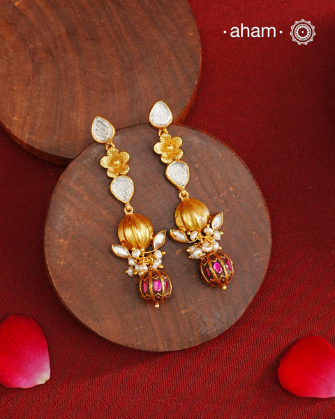 These Gold Polish Peacock Silver Earrings beautifully reflect the elegance of South Indian traditional design, featuring delicate kemp and pearl work along with some kundan highlights. Crafted from 92.5% pure silver with a fine gold polish, it is a graceful and timeless design that complements your style effortlessly.