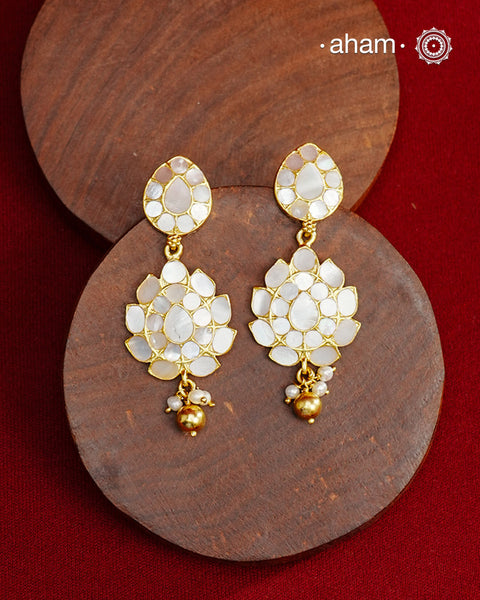 Embrace the allure of timeless elegance with Aham Jewellery’s latest Mother of Pearl collection, a radiant choice for festive celebrations and weddings. Each piece is crafted in 92.5 silver and adorned with a luxurious gold polish, capturing the iridescent beauty of mother of pearl.

This collection is designed with festivities, bridesmaids, and destination weddings in mind, offering a versatile blend of tradition and contemporary charm. Ideal for those seeking an ethereal statement, our Mother of Pearl col