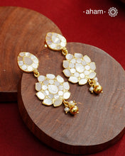 Embrace the allure of timeless elegance with Aham Jewellery’s latest Mother of Pearl collection, a radiant choice for festive celebrations and weddings. Each piece is crafted in 92.5 silver and adorned with a luxurious gold polish, capturing the iridescent beauty of mother of pearl.

This collection is designed with festivities, bridesmaids, and destination weddings in mind, offering a versatile blend of tradition and contemporary charm. Ideal for those seeking an ethereal statement, our Mother of Pearl col