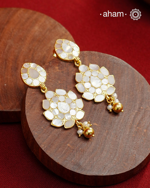 Embrace the allure of timeless elegance with Aham Jewellery’s latest Mother of Pearl collection, a radiant choice for festive celebrations and weddings. Each piece is crafted in 92.5 silver and adorned with a luxurious gold polish, capturing the iridescent beauty of mother of pearl.

This collection is designed with festivities, bridesmaids, and destination weddings in mind, offering a versatile blend of tradition and contemporary charm. Ideal for those seeking an ethereal statement, our Mother of Pearl col