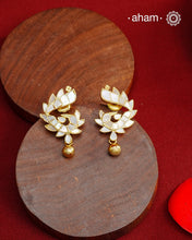 Embrace the allure of timeless elegance with Aham Jewellery’s latest Mother of Pearl collection, a radiant choice for festive celebrations and weddings. Each piece is crafted in 92.5 silver and adorned with a luxurious gold polish, capturing the iridescent beauty of mother of pearl.

This collection is designed with festivities, bridesmaids, and destination weddings in mind, offering a versatile blend of tradition and contemporary charm. Ideal for those seeking an ethereal statement, our Mother of Pearl col