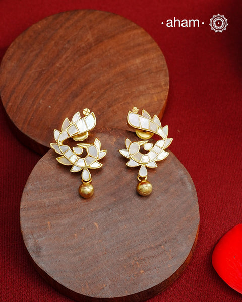 Embrace the allure of timeless elegance with Aham Jewellery’s latest Mother of Pearl collection, a radiant choice for festive celebrations and weddings. Each piece is crafted in 92.5 silver and adorned with a luxurious gold polish, capturing the iridescent beauty of mother of pearl.

This collection is designed with festivities, bridesmaids, and destination weddings in mind, offering a versatile blend of tradition and contemporary charm. Ideal for those seeking an ethereal statement, our Mother of Pearl col