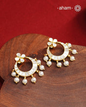 Embrace the allure of timeless elegance with Aham Jewellery’s latest Mother of Pearl collection, a radiant choice for festive celebrations and weddings. Each piece is crafted in 92.5 silver and adorned with a luxurious gold polish, capturing the iridescent beauty of mother of pearl.

This collection is designed with festivities, bridesmaids, and destination weddings in mind, offering a versatile blend of tradition and contemporary charm. Ideal for those seeking an ethereal statement, our Mother of Pearl col