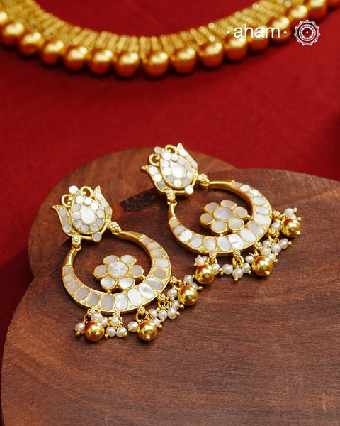 Embrace the allure of timeless elegance with Aham Jewellery’s latest Mother of Pearl collection, a radiant choice for festive celebrations and weddings. Each piece is crafted in 92.5 silver and adorned with a luxurious gold polish, capturing the iridescent beauty of mother of pearl.

This collection is designed with festivities, bridesmaids, and destination weddings in mind, offering a versatile blend of tradition and contemporary charm. Ideal for those seeking an ethereal statement, our Mother of Pearl col