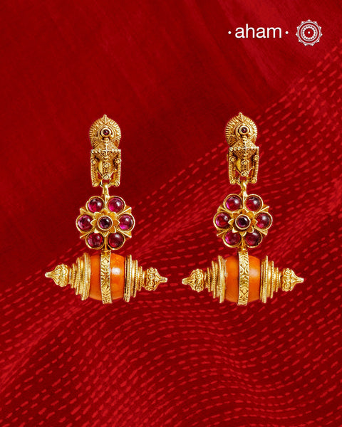 Statement gold polish earring with beautiful.
Handcrafted using traditional methods in 92.5 sterling silver with gold polish. 
Pair these with your ethnic outfits this festive season to ace your look.