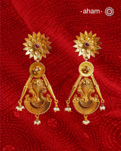 Statement gold polish earring with beautiful designs inspired from the temples of South India. Handcrafted using traditional methods in 92.5 sterling silver with dull gold polish.&nbsp;