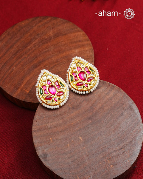 Festive gold polish studs with vibrant floral kundan work. Handcrafted in 92.5 sterling silver using jadau kundan techniques. Perfect for special occasions, pair these floral earrings with your favourite ethnic outfits.