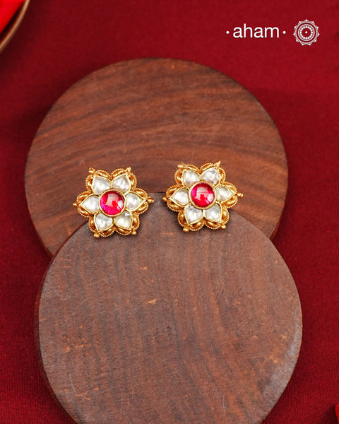 Traditional Gold Polish Studs with a kemp Center.Handcrafted using traditional methods in 92.5 sterling silver with gold polish.Perfect to Pair these with your ethnic outfits this festive season.