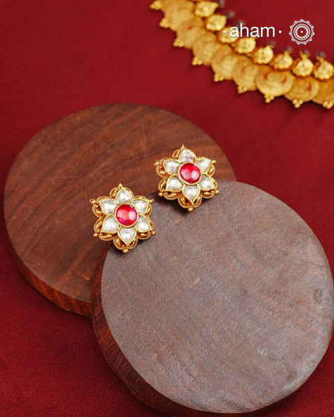 Traditional Gold Polish Studs with a kemp Center.Handcrafted using traditional methods in 92.5 sterling silver with gold polish.Perfect to Pair these with your ethnic outfits this festive season.