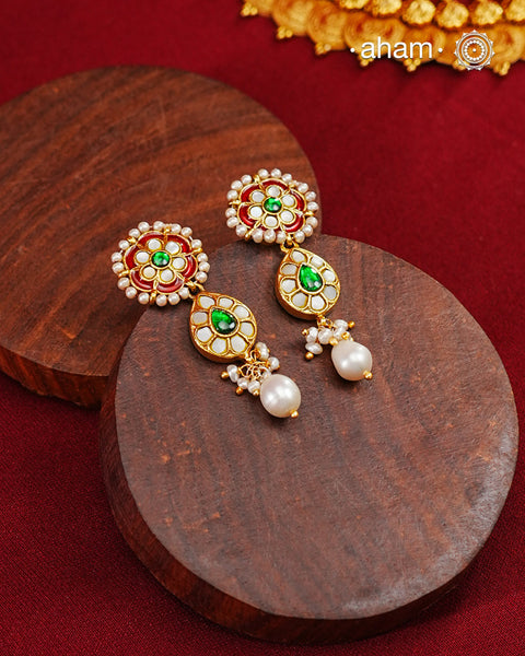 Traditional Gold Polish earrings with kundan and pearl work.&nbsp;
Handcrafted using traditional methods in 92.5 sterling silver with gold polish.&nbsp;
Perfect to Pair these with your ethnic outfits this festive season.
