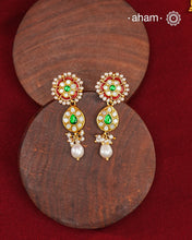 Traditional Gold Polish earrings with kundan and pearl work.&nbsp;
Handcrafted using traditional methods in 92.5 sterling silver with gold polish.&nbsp;
Perfect to Pair these with your ethnic outfits this festive season.