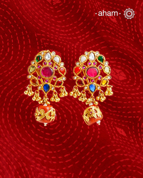 Add a touch of elegance to your everyday look with these stunning, Navratna gold-polished sterling silver earrings. Adorned with a beautiful, traditional design, these earrings are perfect for special occasions and can be effortlessly mixed and matched to create a timeless yet truly unique style. Make a lasting statement with these ever-green earrings!