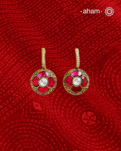 These two-sided hoop earrings combine classic elegance with contemporary design. Made from 92.5% silver and finished with a fine gold polish, they showcase red kundan stones on one side and green kundan on the other. This dual-sided feature offers versatile styling options, complementing a wide range of Indian attire. Expertly crafted, these earrings deliver both quality and adaptability for sophisticated everyday or festive wear.