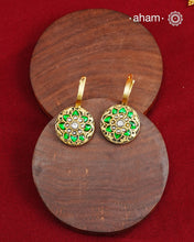 These two-sided hoop earrings combine classic elegance with contemporary design. Made from 92.5% silver and finished with a fine gold polish, they showcase red kundan stones on one side and green kundan on the other. This dual-sided feature offers versatile styling options, complementing a wide range of Indian attire. Expertly crafted, these earrings deliver both quality and adaptability for sophisticated everyday or festive wear.
