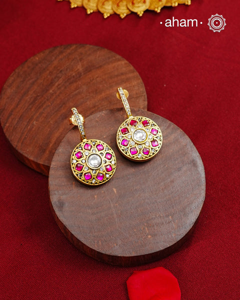 Half hoop pattern&nbsp;Made from 92.5% silver and finished with a fine gold polish, they showcase red kundan stones on one side and red &&nbsp; green kundan on the back side. Expertly crafted, these earrings deliver both quality and adaptability for sophisticated everyday or festive wear.
