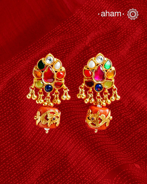 Add a touch of elegance to your everyday look with these stunning, Navratna gold-polished sterling silver earrings. Adorned with a beautiful, traditional design, these earrings are perfect for special occasions and can be effortlessly mixed and matched to create a timeless yet truly unique style. Make a lasting statement with these ever-green earrings!
