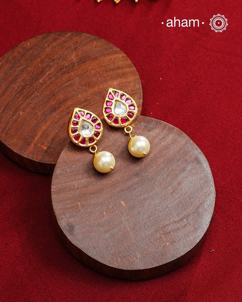 Traditional Gold Polish Studs with a kemp work and pearl drop.  
Handcrafted using traditional methods in 92.5 sterling silver with gold polish. 
Perfect to Pair these with your ethnic outfits this festive season. 