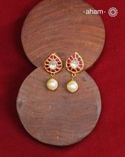 Traditional Gold Polish Studs with a kemp work and pearl drop.  
Handcrafted using traditional methods in 92.5 sterling silver with gold polish. 
Perfect to Pair these with your ethnic outfits this festive season. 