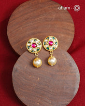 Traditional Gold Polish Studs with a kundan work and pearl drop.
Handcrafted using traditional methods in 92.5 sterling silver with gold polish. 
Perfect to Pair these with your ethnic outfits this festive season. 