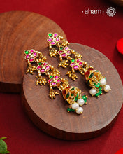 Elegant gold polish silver jumkies embellished with kundan and kemp work. Handcrafted in 92.5 sterling silver and dipped in gold polish. Perfect for special occasions and festivities.