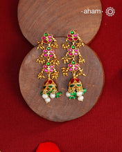 Elegant gold polish silver jumkies embellished with kundan and kemp work. Handcrafted in 92.5 sterling silver and dipped in gold polish. Perfect for special occasions and festivities.