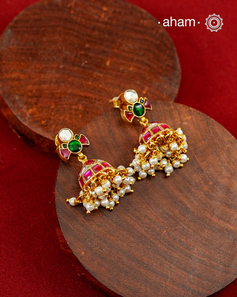 A classic pair of jhumkies designed to add colour, elegance, and heritage charm to any jewellery collection. Crafted in 92.5 silver with fine kundan work and laced with delicate pearls.