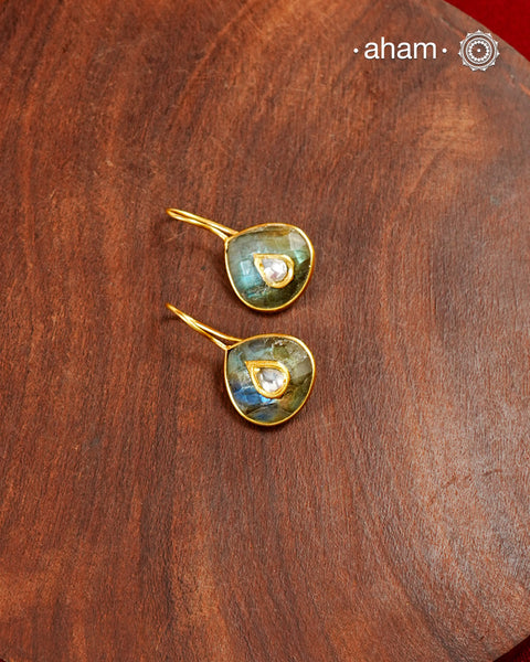 Gold Polish Silver Earrings feature exquisite kundan inlay work, blending traditional craftsmanship with contemporary style. Perfectly suited for Indo-Western ensembles, they add a touch of elegance and sophistication to your look. Crafted with attention to detail making them a versatile accessory for every occassion.