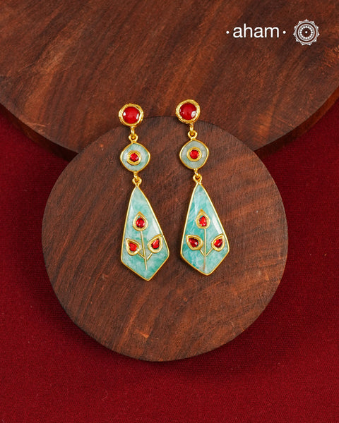 Gold Polish Silver Earrings feature exquisite kundan inlay work, blending traditional craftsmanship with contemporary style. Perfectly suited for Indo-Western ensembles, they add a touch of elegance and sophistication to your look. Crafted with attention to detail making them a versatile accessory for special occasions.