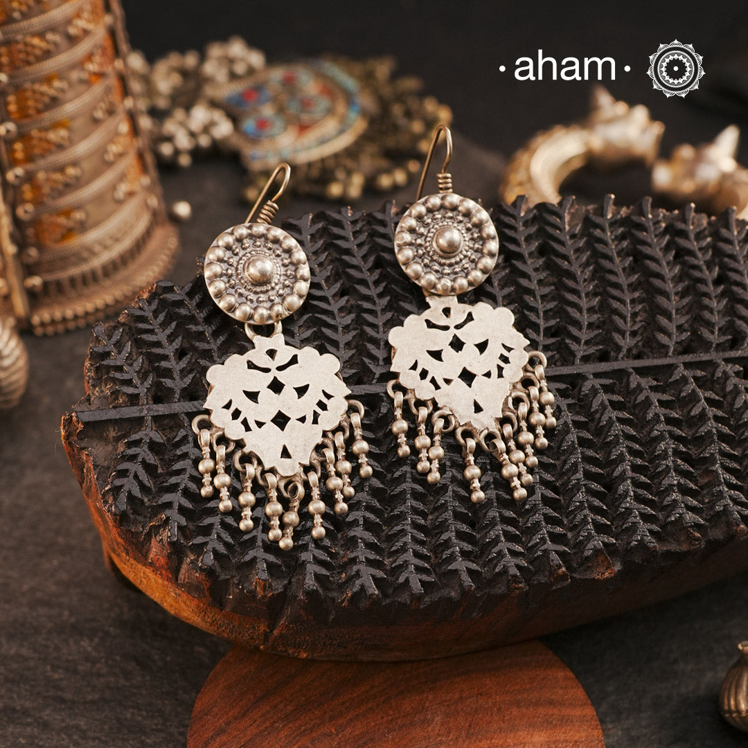 Lightweight yet striking, our Tribal Cutwork Silver Earrings are a perfect blend of tradition and elegance. Crafted in silver, these danglers showcase beautiful cutwork detailing, adding movement and charm to every look. Designed for comfort, they make a beautiful complement to your ethnic everyday outfits, effortlessly elevating your style with their handcrafted finesse.