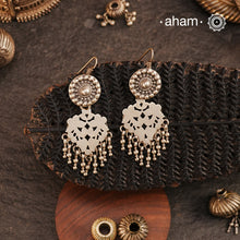 Lightweight yet striking, our Tribal Cutwork Silver Earrings are a perfect blend of tradition and elegance. Crafted in&nbsp;silver, these danglers showcase beautiful cutwork detailing, adding movement and charm to every look. Designed for comfort, they make a beautiful complement to your&nbsp;ethnic everyday outfits, effortlessly elevating your style with their handcrafted finesse.