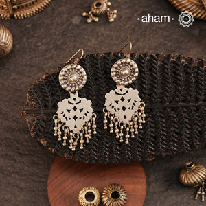 Lightweight yet striking, our Tribal Cutwork Silver Earrings are a perfect blend of tradition and elegance. Crafted in&nbsp;silver, these danglers showcase beautiful cutwork detailing, adding movement and charm to every look. Designed for comfort, they make a beautiful complement to your&nbsp;ethnic everyday outfits, effortlessly elevating your style with their handcrafted finesse.