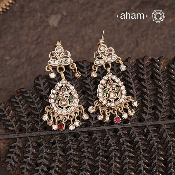 Vintage silver earrings with glass stones crafted in traditional artistry and craftsmanship. An ode to the glorious state of Rajasthan.