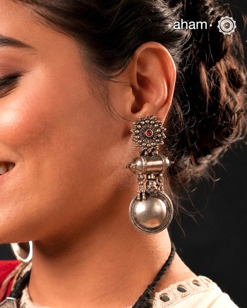 Tribal Silver Amulet earring. A statement piece, yet light enough for its size.&nbsp;
We would totally recomend you get this for your Navratri wardrobe.&nbsp;
Please note since these are vintage pieces put together, there might be some variations in the design.