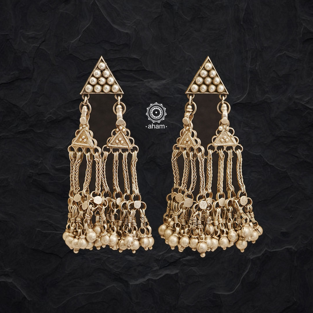 Turn heads with these one-of-a-kind earrings crafted from tribal hair ornaments. These beautiful silver earrings make a unique statement piece sure to stand out.