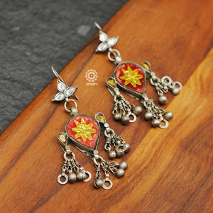 Tribal silver earrings with statement ghungroos. Created with traditional artistry and craftsmanship. An ode to the glorious state of Rajasthan. Pair these with your ethnic outfit for a classic look.