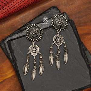 Tribal silver  earrings with Leaf shaped top and statement ghungroos. Created with traditional artistry and craftsmanship. An ode to the glorious state of Rajasthan. Pair these with your ethnic outfit for a classic look.