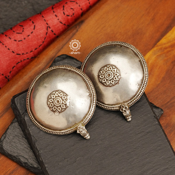 Tribal silver oversized studs.  There is a different charm to old world pieces. So unique, so beautiful, heirloom pieces.  Tribal silver earrings that will make a beautiful edition to your collection. Please note since these are made from assorted old pieces, there might be some minor variations between the two pieces.  These pieces were a part of a vintage neckpiece that have been converted into earrings. 