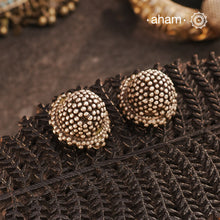 Don’t be fooled by their simplicity—our&nbsp;Tribal Silver Studs are a masterpiece of craftsmanship. Each tiny ghungroo is individually hand-tied, not cast, using traditional techniques that are slowly fading away. Crafted in&nbsp;silver, these studs are a tribute to India’s rich tribal jewellery heritage, offering you a timeless, understated elegance.