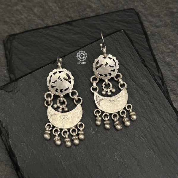 Tribal earrings created in silver with traditional cutwork artistry and craftsmanship. 